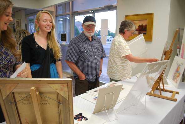 Julie (Logan Fine Art staff and enthusiastic support), Katie (the fabulous daughter), Glen (my USU illustration professor and mentor friend), and Barb (art buddy forever) at the table display of my illustrations.